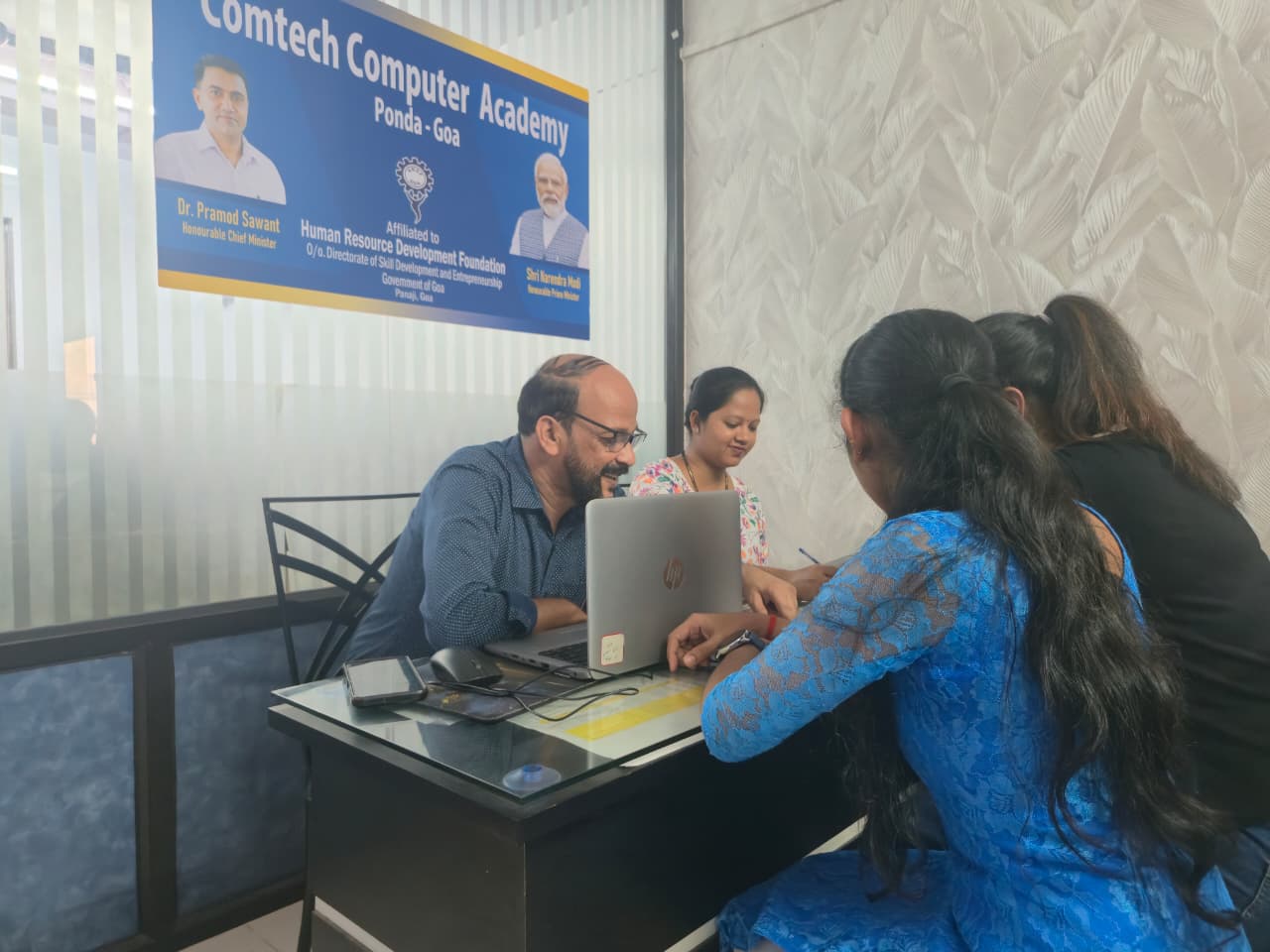 Students practicing accounting and computer skills